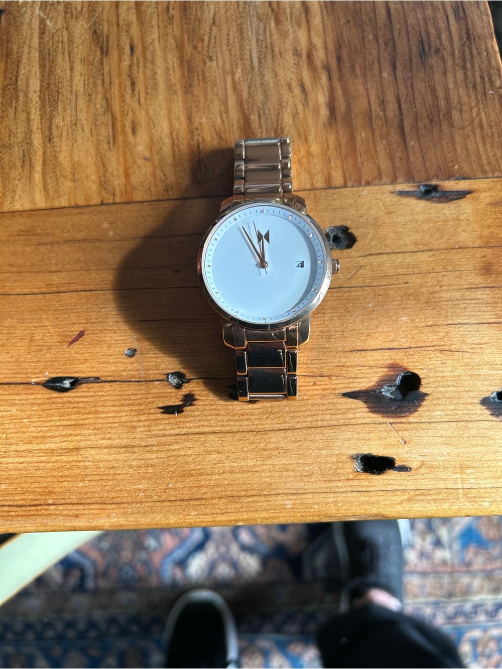 MVMT rose gold tone watch with White Dial date window at 3 o’clock.